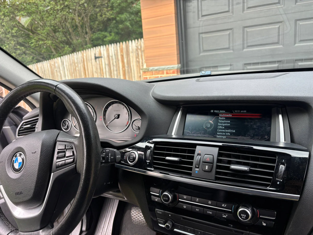 2015 BMW X3 F25 before the upgrade, with the original recessed BMW iDrive display