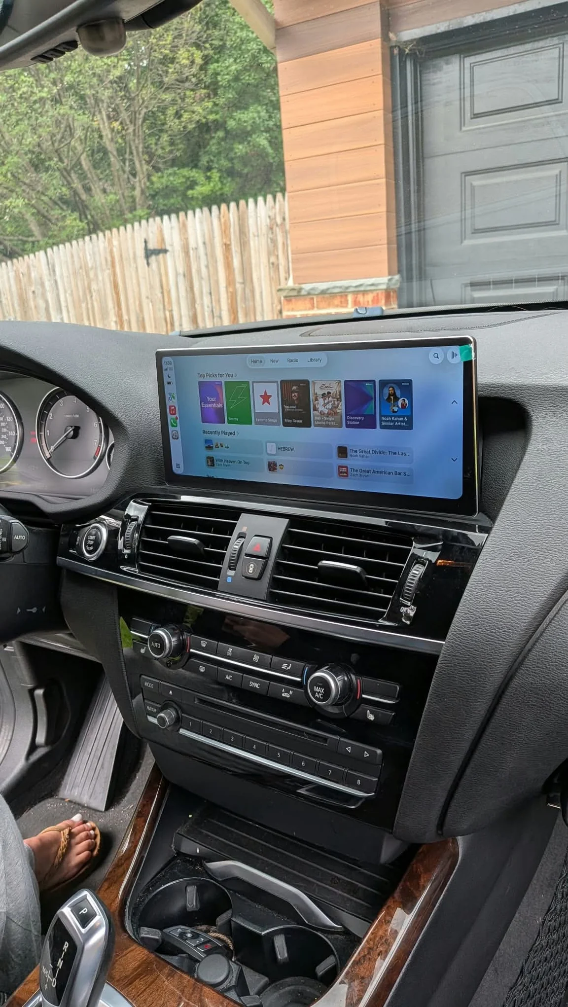 The same BMW X3 after installation, with Apple CarPlay on the replacement touchscreen