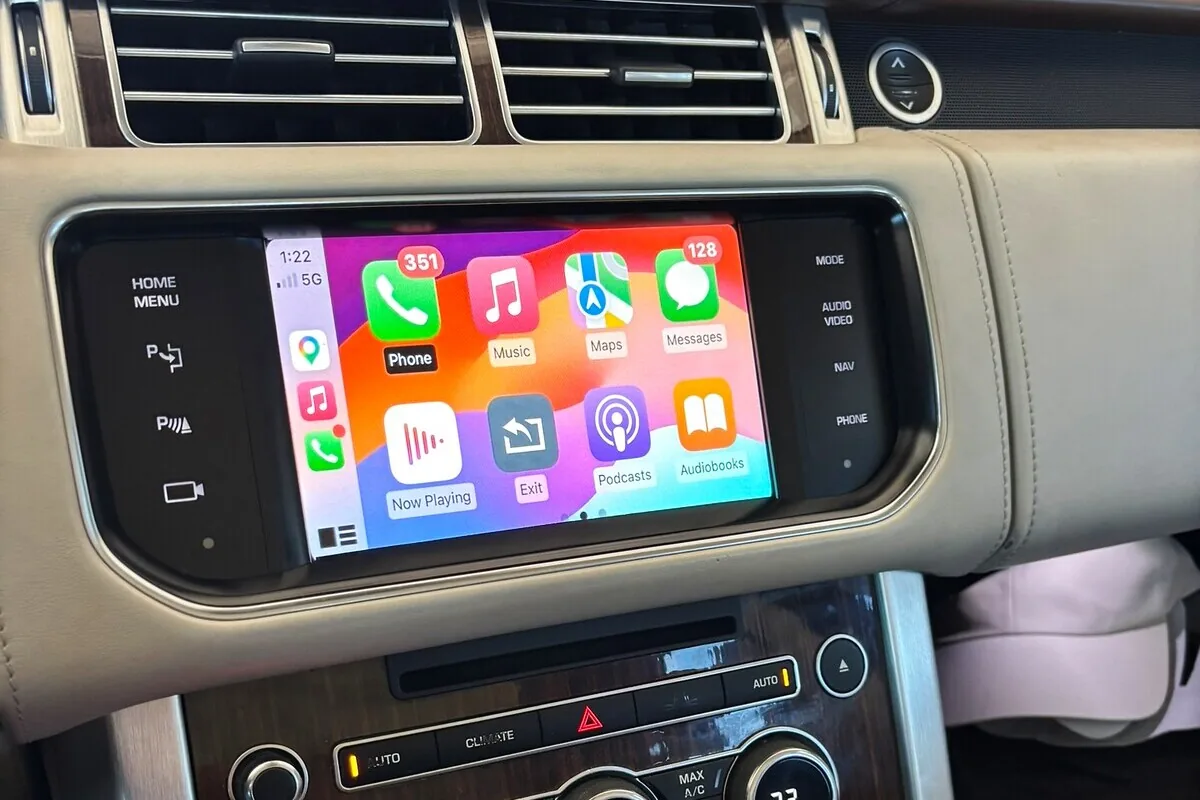 Close-up of the Apple CarPlay home screen on the original Range Rover display