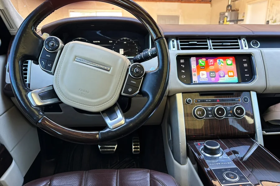 2015 Range Rover dashboard with Apple CarPlay running on its original factory screen